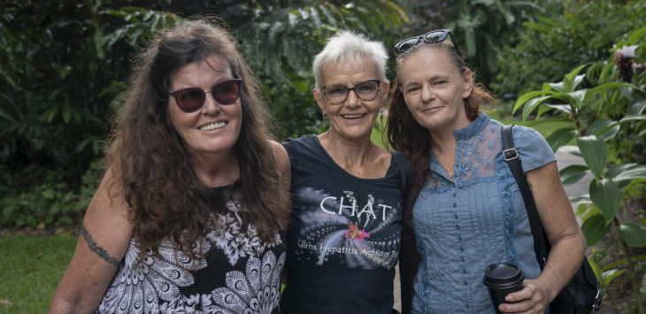 L:R Rozanne Alexander, Kathy Clarke and Tracey Walker smile for a portrait inside the Cairns Botanical Gardens in northern Queensland, Australia. All three women were treated for hepatitis C using new Direct Acting Antiviral (DAA) medication at Cairns Sexual Health Service. With the introduction of the new DAA’s in 2016, Cairns Sexual Health has been the driving service among a broader network that includes Lotus Glen Prison, Youthlink Needle and Syringe Program and the Cairns Hospital’s Liver Health Clinic. Collectively the services have achieved very high rates of hepatitis C testing and treatment.